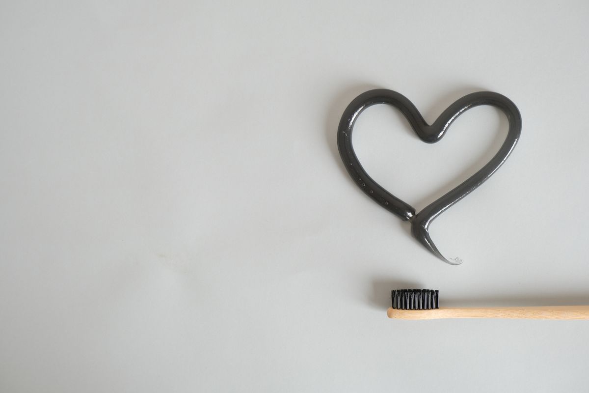 Charcoal toothpaste on a toothbrush